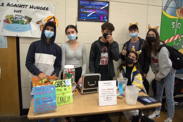 Dearborn High School students hold a fundraiser to support the Battle Against Hunger during lunch at the school in November 2021.