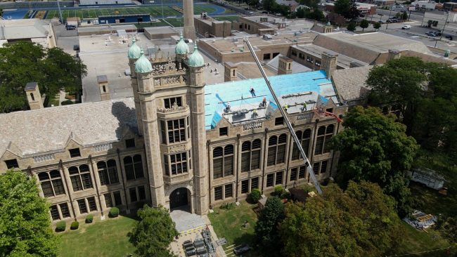 A drone photo shows the roof at Fordson High School under repair in the summer of 2022.