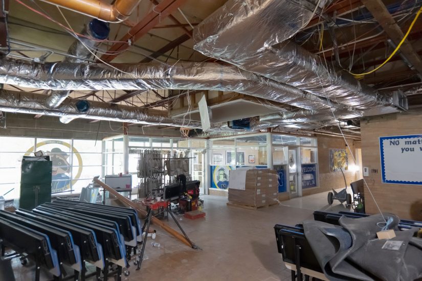 The bare ceiling at in the lobby at Nowlin Elementary shows new air handling ductwork and other infrastructure.